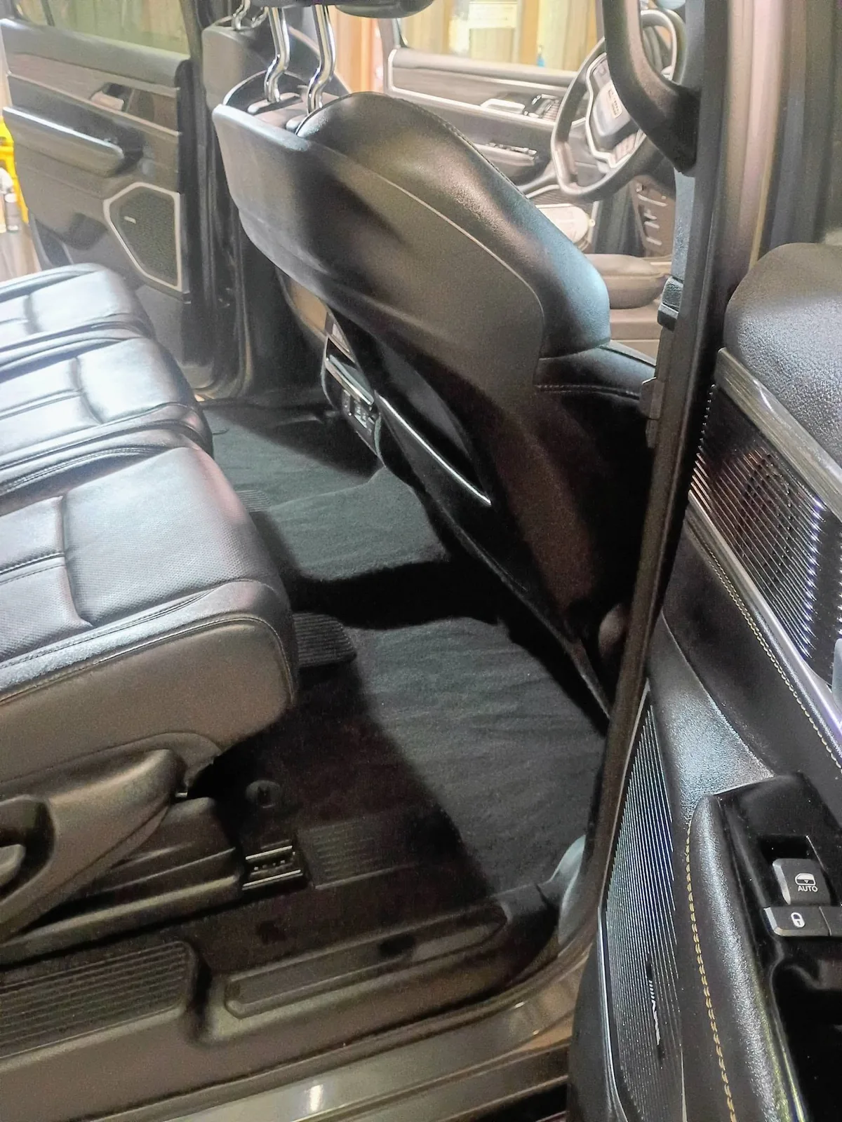 Dark vehicle seating photographed for interior detailing